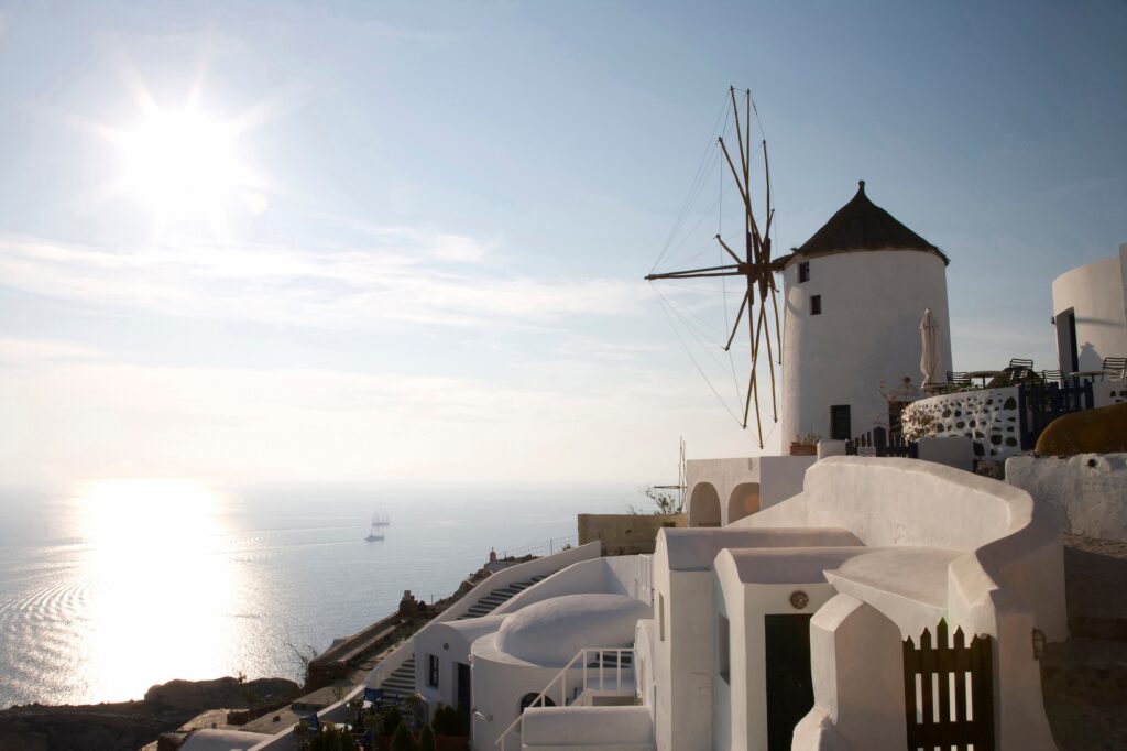 View of Windmill On Hillside, Oia, Santorini, Cyclades, Greece | SUPERPOBYT TRAVEL